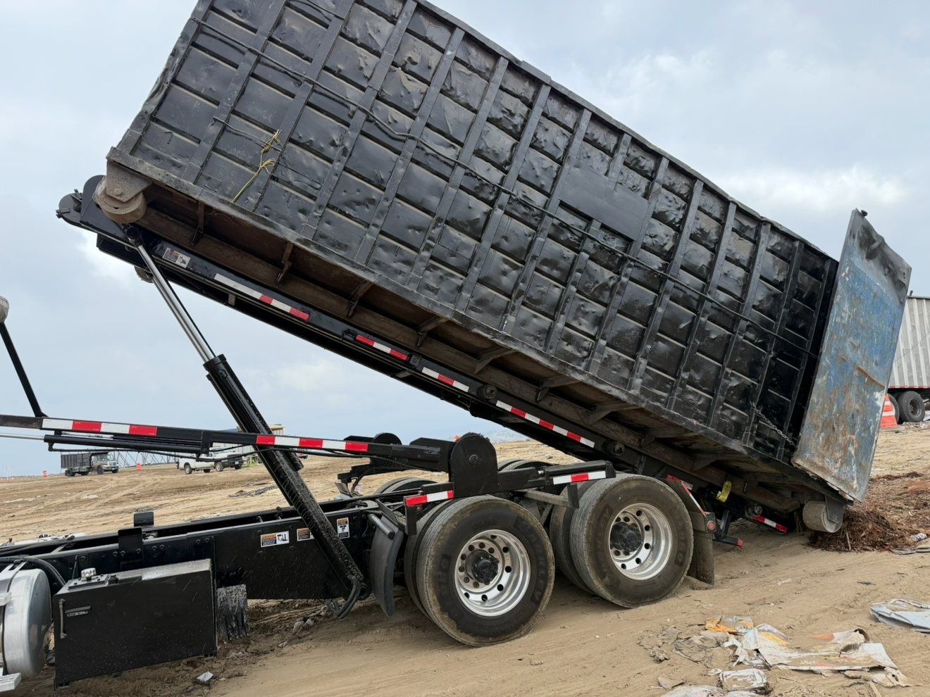 Loaded roll-off container on a roll-off truck